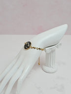 Pulsera Nube artesanal con flor natural preservada; material: acero inoxidable, vista 2